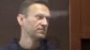 RUSSIA -- Aleksei Navalny, accused of slandering a Russian World War Two veteran, stands inside a defendant dock during a court hearing in Moscow, Russia February 5, 2021
