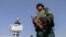 AFGHANISTAN -- An Afghan security official stands gaurd at a check point in Kandahar, Afghanistan, 12 August 2021.