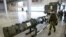 RUSSIA -- A Russian military officer walks past the 9M729 land-based cruise missile on display with its launcher, right, in Kubinka outside Moscow, Russia, Wednesday, Jan. 23, 2019