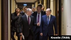 Russian President Vladimir Putin (left, front) and Federal Security Service (FSB) Director Aleksandr Bortnikov (right, front) arrive for a February 10, 2020 meeting of the FSB Board at the agency's headquarters in Moscow.