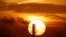 Belarus - The sun rises behind a chimney in Minsk. 4Mar2019