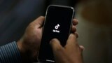 PAKISTAN -- A man opens social media app 'TikTok' on his cell phone, in Islamabad, July 21, 2020