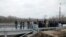 UKRAINE -- People visits a section of the restored bridge, which was exploded during a military conflict between Ukrainian government forces and Russian-backed rebels, in the settlement of Stanytsya Luhanska, November 20, 2019