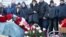 RUSSIA --  People gather at a makeshift memorial to victims of the March 25, 2018 fire at the Zimnyaya Vishnya in Kemerovo, March 25, 2019