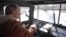 RUSSIA -- Russian President Vladimir Putin sits behind the wheel during a holiday in the Siberian taiga, March 21, 2021