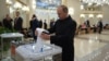 President Vladimir Putin, dispensing with anti-coronavirus gloves and a face mask, votes in Moscow on July 1 on Russia's proposed 206 constitutional changes. 