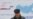 RUSSIA -- A man walks near a board, which informs of the upcoming presidential election, in a street in Stavropol, Russia February 5, 2018