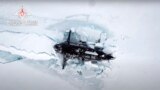 RUSSIA -- A Russian nuclear submarine breaks through the Arctic ice during military drills at an unspecified location, March 26, 2021