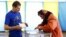 UKRAINE – People cast their ballots during voting in a presidential election at polling station in the village of Kosmach in the Ivano-Frankivsk region of western Ukraine May 25, 2014