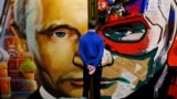 RUSSIA -- A man looks at a painting depicting Russian president Vladimir Putin at the "SUPERPUTIN" exhibition at UMAM museum in Moscow, December 6, 2017