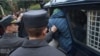 В Беларуси двое инженеров получили до трех лет колонии: во время антивоенного митинга они "шли" на отступавшего от них спиной силовика