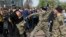 Russia -- Fighters of National Liberation movement clash with protesters during clashes at a demonstration against President Vladimir Putin in Pushkin Square in Moscow, Russia, Saturday, May 5, 2018