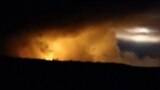 UKRAINE -- Smoke and flame rise from the Ukrainian defence ministry ammunition depot explosion in the eastern Chernihiv region, October 9, 2018