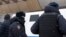 RUSSIA -- Police officers stand in front of a hotel where participants of a forum of independent members of municipal councils gathered in Moscow, March 13, 2021
