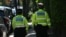 Police officers patrol outside the home of British Prime Minister Keir Starmer in London on May 13, 2025. A 21-year-old man was arrested early Tuesday over suspected arson attacks on two properties linked to the UK Prime Minister.