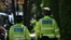 Police officers patrol outside the home of British Prime Minister Keir Starmer in London on May 13, 2025. A 21-year-old man was arrested early Tuesday over suspected arson attacks on two properties linked to the UK Prime Minister.