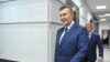 Russia -- Ukrainian former President Viktor Yanukovych walks towards the media after a video link with a Ukrainian court during the trial of former riot police force members, suspected of killing participants of the 2014 anti-government and pro-European U
