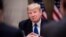 SWITZERLAND -- US President Donald Trump listens to a speaker during a working dinner with European business leaders during the World Economic Forum (WEF) annual meeting in Davos, eastern Switzerland, on January 25, 2018