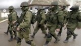 UKRAINE – Russian soldiers march outside an Ukrainian military base in Perevalne, Crimea, March 20, 2014