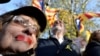 Belgium, Brussels, A woman wears a plaster as she demonstrate to show support to ousted leader Carles Puigdemont 12nov2017