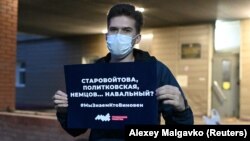 A protester in the Siberian city of Omsk holds a sign asking whether anti-corruption activist Aleksei Navalny will join a list of Russians (politician Boris Nemtsov, journalist Anna Politkovskaya, and politician Galina Starovoitova) believed murdered for political reasons. 