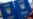 Generic – Two Ukrainian passports in front of Brandenburg Gate in Berlin, Germany. Travel concept