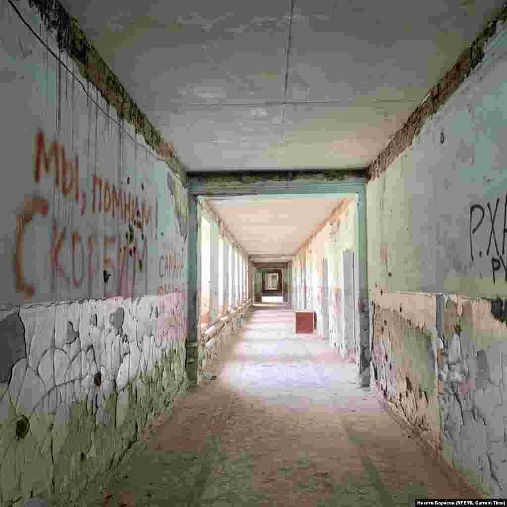 A corridor in School No. 1. Writing on the left wall declares &quot;We remember!&quot; and &quot;We grieve.&quot;&nbsp;