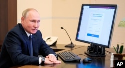 President Vladimir Putin after voting online on September 17, 2021, the first day of voting in Russia's 2021 parliamentary-regional elections