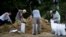 US -- People fill bags with sand at the Lynn Haven Sports Complex while preparing for Hurricane Michael October 9, 2018 in Panama City, Florida. / AFP PHOTO / Brendan Smialowski
