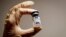 ILLUSTRATION -- RUSSIA -- A medical specialist holds a vial of Sputnik V vaccine against the coronavirus in a department store in Moscow, Russia, January 18, 2021 
