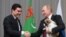 RUSSIA -- Turkmen President Gurbanguly Berdymukhammedov (L) shakes hands with his Russian counterpart Vladimir Putin after presenting him a Turkmen shepherd dog, locally known as Alabai, during a meeting in Sochi, October 11, 2017