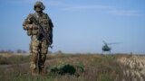 UKRAINE -- A serviceman secures an area as Ukrainian President Volodymyr Zelenskiy visits positions of armed forces in Donetsk region, October 14, 2019