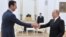 Russia -- Russian President Vladimir Putin (R) meets with Syrian President Bashar al-Assad at the Kremlin in Moscow, October 21, 2015