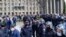 RUSSIA -- Police officers stand guard as people protest coronavirus measures that have squeezed the local economy and demand the governor resign, in North Ossetia’s regional capital Vladikavkaz, April 20, 2020