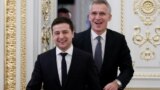 UKRAINE -- Ukrainian President Volodymyr Zelenskiy and NATO Secretary-General Jens Stoltenberg react while entering a hall following their talks in Kyiv, October 31, 2019