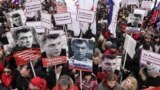 RUSSIA – People attend a rally in memory of Russian opposition politician Boris Nemtsov, who was assassinated in 2015, in Moscow, Russia February 24, 2019