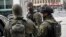 Sweden -- Special Police forces work at the scene where a truck crashed into the Ahlens department store at Drottninggatan in central Stockholm, April 7, 2017