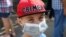 UKRAINE -- CRIMEA,  SEPTEMBER 4, 2018: Children wear face masks as they wait for buses outside Secondary School No 3 in Armyansk, north Crimea, where high concentrations of sulphur dioxide have been confirmed following a sudden release of vapours of a tox