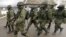 UKRAINE – Russian soldiers march outside an Ukrainian military base in Perevalne, Crimea, March 20, 2014