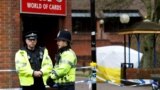 U.K. -- Police officers stand on duty at a cordon near a bench covered in a protective tent at The Maltings shopping centre in Salisbury, March 12, 2018