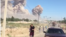 Kazakhstan - People trying to leave Arys on the background of a cloud of smoke from exploding ammunition. Turkestan region, 24Jun2019.
