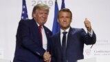FRANCE - French President Emmanuel Macron shakes hands with U.S. President Donald Trump after a joint press conference at the end of the G7 summit in Biarritz, France, August 26, 2019