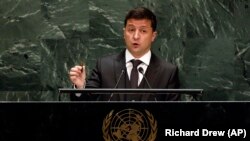 Holding up a bullet, Ukrainian President Volodymyr Zelenskiy addressed the 74th session of the United Nations General Assembly on September 25, 2019. 