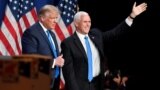 President Donald J. Trump and Vice President Mike R. Pence react at the Republican National Convention at the Republican National Convention in Charlotte, North Carolina, U.S., August 24, 2020. David T. Foster/Pool via REUTERS