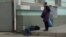 Ukraine, Crimea, Simferopol, Russia - March 27, Simferopol, drunk man sleeping in the street12Apr2015