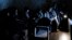 NAGORNO KARABAKH -- In this handout photo released by the Armenian Foreign Ministry on Monday, Sept. 28, 2020, people watch the State TV as they gather in a bomb shelter to protect against the shelling in Stepanakert, the self-proclaimed Republic of Nagor