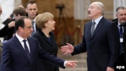 German Chancellor Angela Merkel (center) with Belarusian President Alyaksandr Lukashenka (right) and French President Francois Hollande (left) as she leaves Minsk-based Ukrainian peace negotiations in 2015.