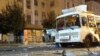 RUSSIA -- A burned down passenger bus is pictured by the Galereya Chizhova [Chizhov’s Gallery] shopping center in Voronezh, August 12, 2021