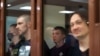 RUSSIA -- Maksim Umetbayev and Igor Lyakhovets (L-R front), former officers of Moscow's Western District Police Department, charged with framing journalist Ivan Golunov, attend the announcement of the verdict at the Moscow City Court, May 28, 2021