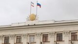 Ukraine - Crimea's and Russia's flags n a building of Council of Ministers in Simferopol